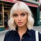 Platinum blonde women's short wavy blonde bob wig with bangs, heat-resistant synthetic wig, suitable for everyday wear and parties.